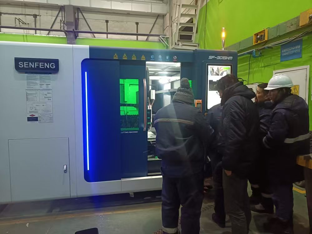 Yang trains engineers on how to operate the fiber laser cutting machine